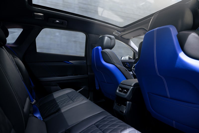 Back Seat View of the 2026 OPTIQ-V Blue Front Seats, Sun Roof, and Interior | Mitch Hall Cadillac in Lamesa TX